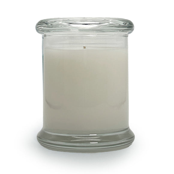 Soy blend candle in a clear glass jar with glass top
