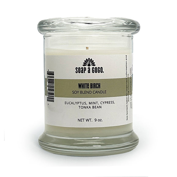 Soy blend candle in a clear glass jar with glass top