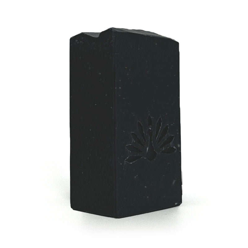 Black soap bar with a brand logo on a white background