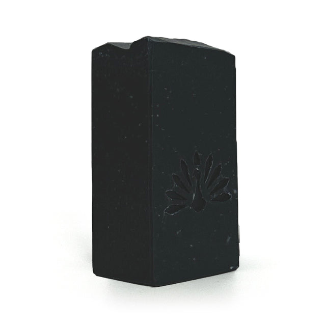 Black soap bar with a brand logo on a white background