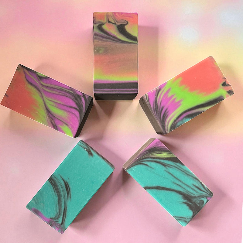 5 multi-colored soaps on a colorful background