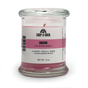 Candle in a glass jar with a label on a white background