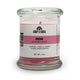 Candle in a glass jar with a label on a white background