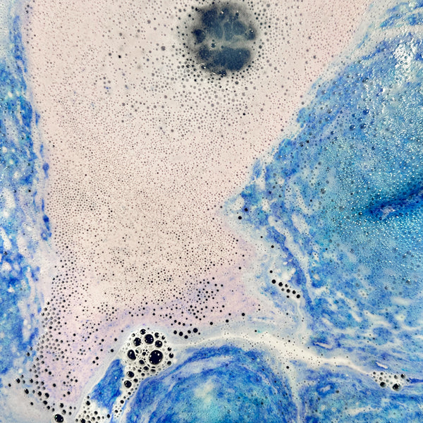 Close-up of bath bomb activated in water