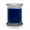 Blue candle in a clear glass jar on a white background