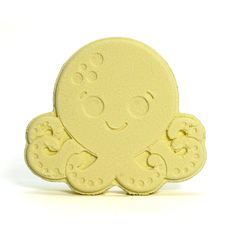 Yellow octopus-shaped bath bomb on a white background