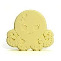 Yellow octopus-shaped bath bomb on a white background