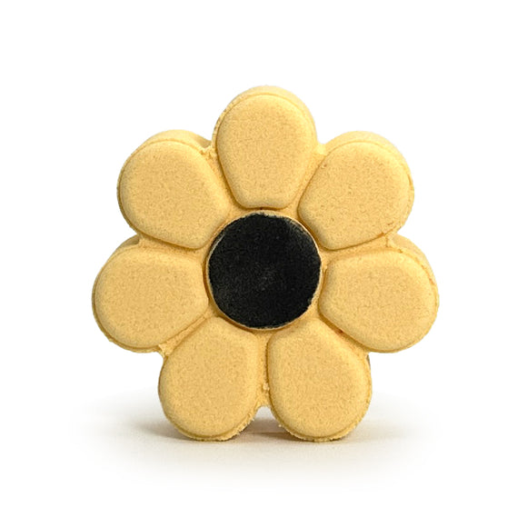 daisy shaped bath bomb in yellow with black center