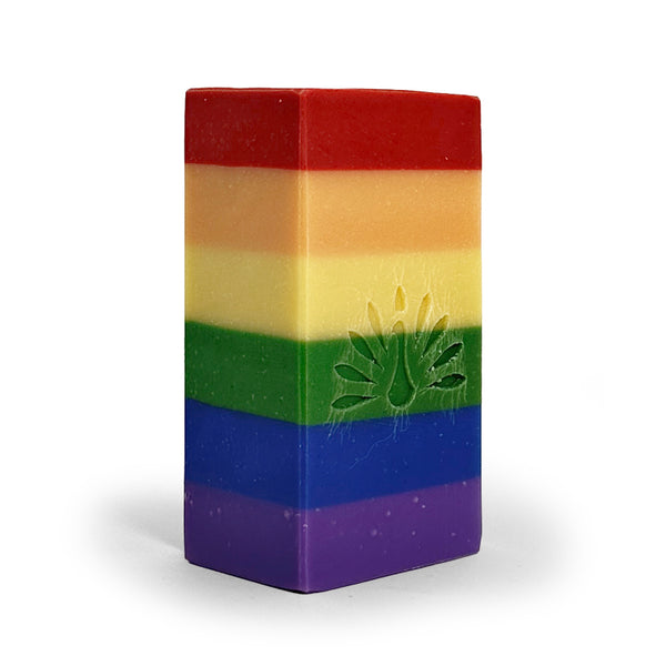 Rainbow-colored soap bar with an embossed logo on a white background