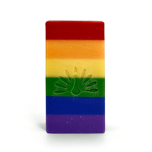 Rainbow-colored soap bar with an embossed logo on a white background