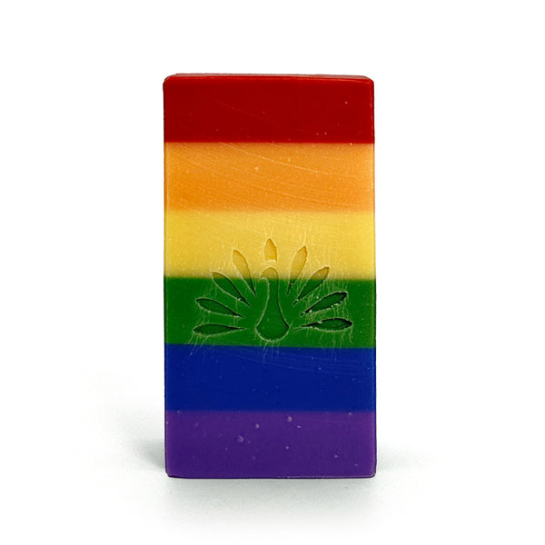 Rainbow-colored soap bar with an embossed logo on a white background