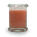 Candle in a clear glass jar on a white background