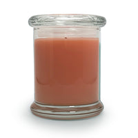 Candle in a clear glass jar on a white background