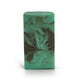 Green and gray swirled soap bar with with peacock logo on a white background
