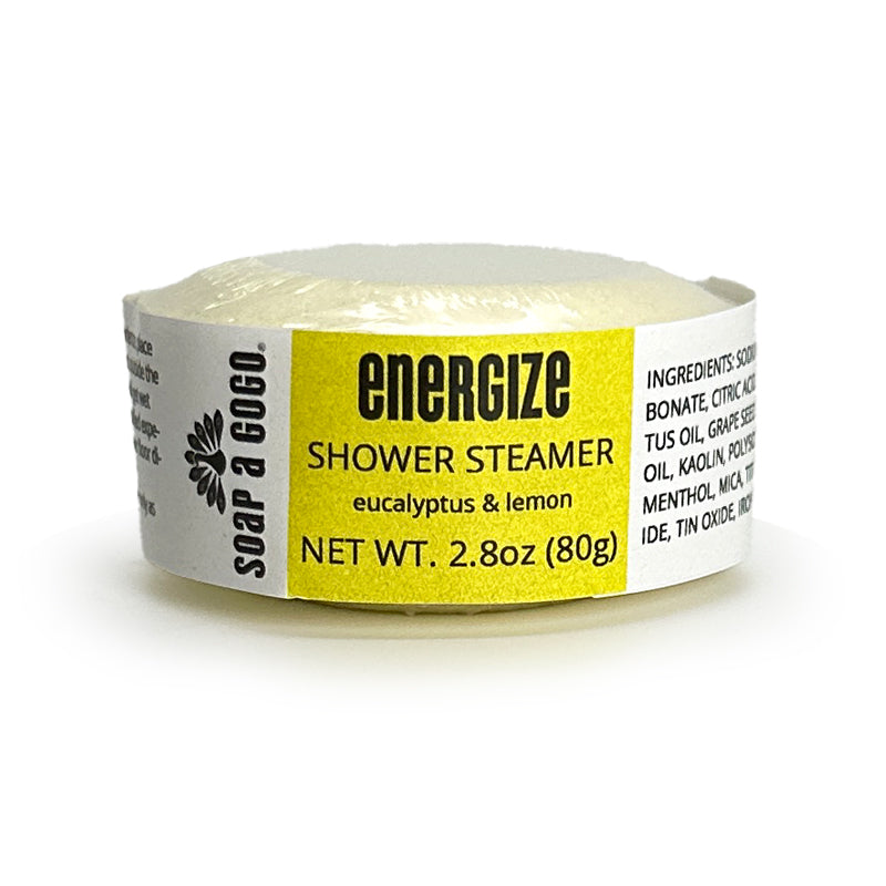 Shower steamer with yellow label on a white background