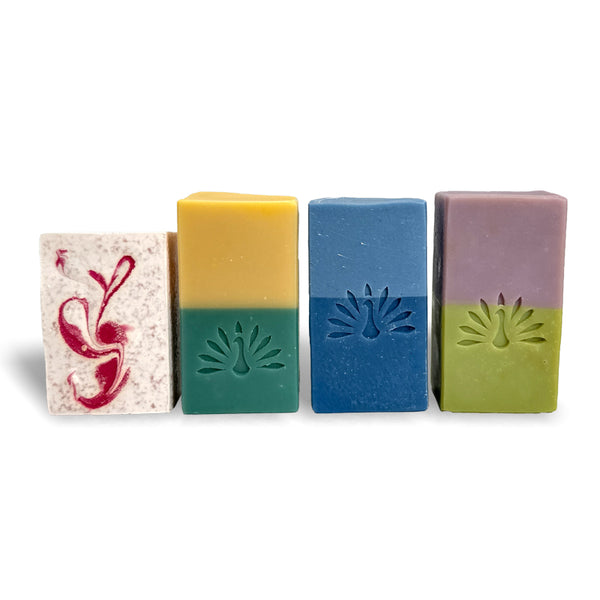 Four colorful soap bars with embossed logo on a white background
