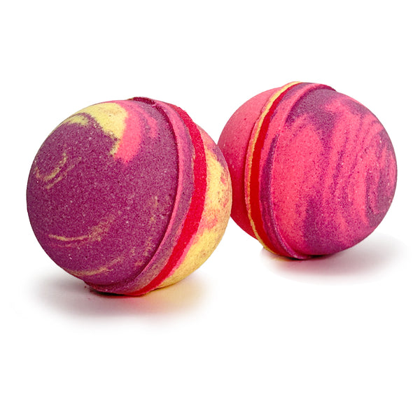 Two round bath bombs with a marbled swirl pattern of magenta pink, red, and pale yellow, shown on a clean white background.