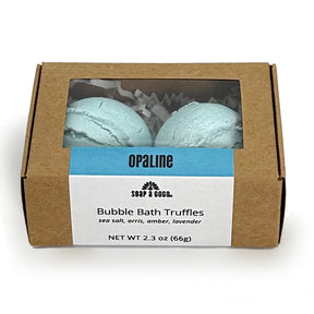 Box of Opaline Bubble Bath Truffles with two blue truffles inside on a white background