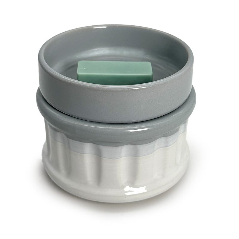 a wax melt in a wax warmer on a white background