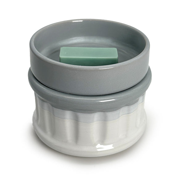 a wax melt in a wax warmer on a white background