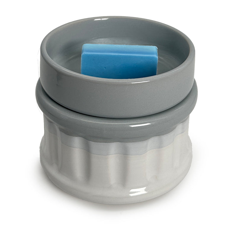 a wax melt in a wax warmer on a white background