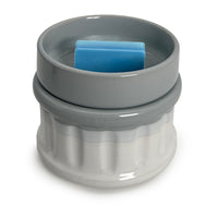 a wax melt in a wax warmer on a white background