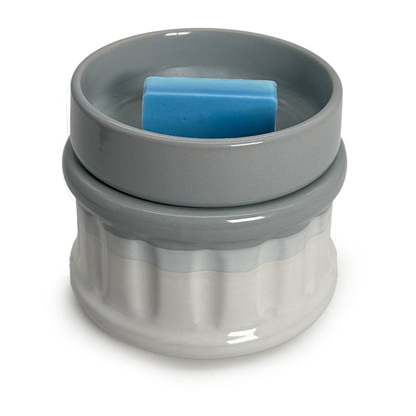 a wax melt in a wax warmer on a white background