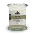 Soy blend candle in a clear glass jar with glass top