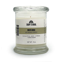 Soy blend candle in a clear glass jar with glass top