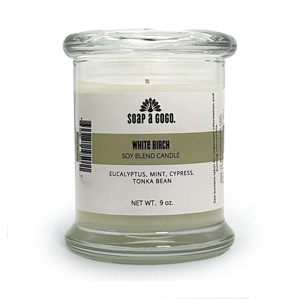 Soy blend candle in a clear glass jar with glass top