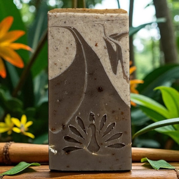 A bar of Hana soap with a tropical background.