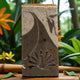 A bar of Hana soap with a tropical background.